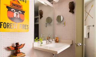 This Wisconsin Hotel Suite Conjures the Best of Summer Camp—Hold the Bug Spray - Photo 2 of 9 - Kitschy references to camp culture, like this warning from Smokey the Bear, can be found throughout the space, but its amenities are all grown up, including Malin + Goetz toiletries.