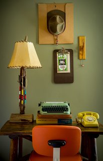 This Wisconsin Hotel Suite Conjures the Best of Summer Camp—Hold the Bug Spray - Photo 4 of 9 - The carefully organized workstation is a nod to scoutmaster rooms, complete with a traditional office chair, antique Adirondack desk, and antique troop leader's hat. 