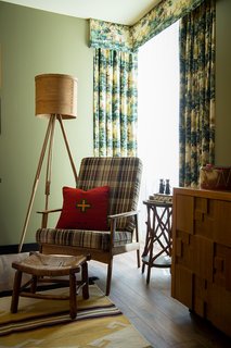 This Wisconsin Hotel Suite Conjures the Best of Summer Camp—Hold the Bug Spray - Photo 8 of 9 - Hunting print draperies complement accessories and toys from the Camp Wandawega Land of Nod collaboration. 