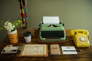 This Wisconsin Hotel Suite Conjures the Best of Summer Camp—Hold the Bug Spray - Photo 5 of 9 - A working vintage typewriter and telephone top the antique desk.