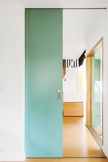 An Australian Renovation Gives New Life to Midcentury Style - Photo 5 of 14 - Sea green details appear throughout the house, peeking out from behind the exterior screen or on interior partitions.