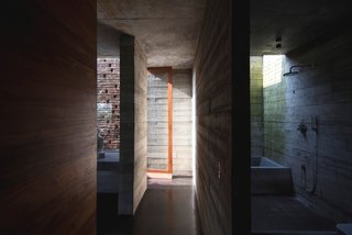 An Architect's Home and Studio Rises Above Rajagiriya - Photo 5 of 6 - Brick and board-formed concrete are the primary materials of the rugged, yet elegant, structure.