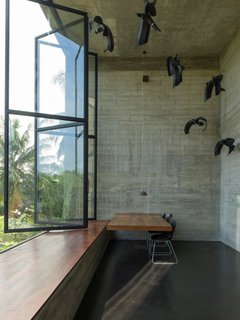 An Architect's Home and Studio Rises Above Rajagiriya - Photo 6 of 6 - Among the most dramatic spaces is a double-height office off of the main studio space with sculptural installation that showcases its soaring ceiling.