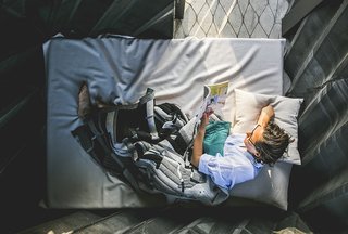 Stay in This 3D-Printed Tiny House - Photo 10 of 19 - The structure has just enough space for a single bed, which folds into a couch when not in use.