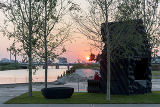 Stay in This 3D-Printed Tiny House - Photo 18 of 19 - The Urban Cabin sits within a pocket park complete with poplar trees designed by Delva Landscape and Boomkwekerij Ebben.