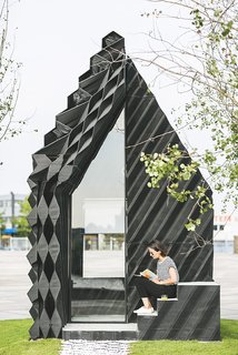 Stay in This 3D-Printed Tiny House - Photo 1 of 19 - The architects used a number of different geometric designs on the facade to showcase the variety that can be achieved with the technique, while also optimizing insulation and material consumption.