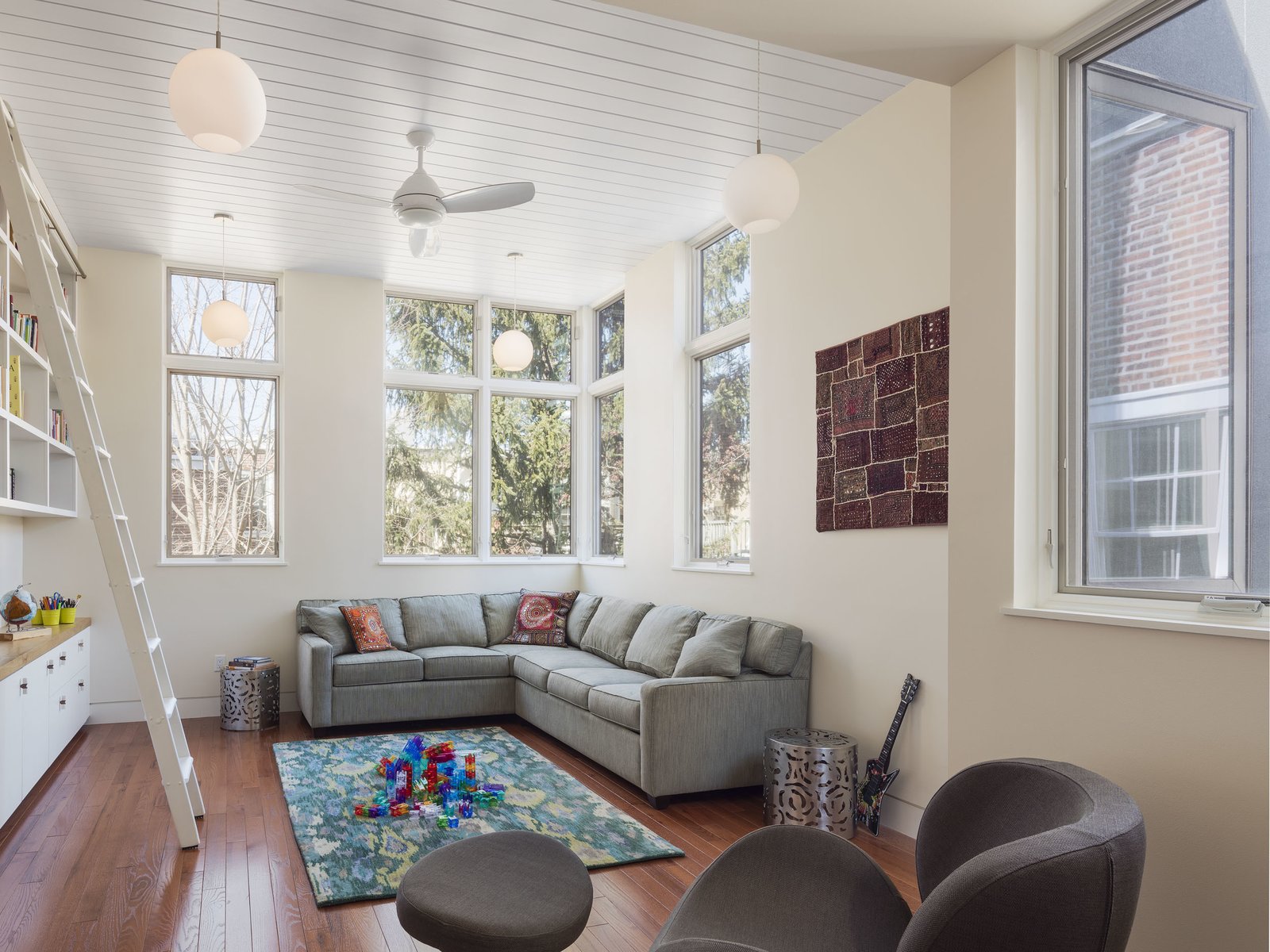 Philadelphia Row House Renovation - Photo 7 of 8 - An addition accommodated a new living area set high up among the surrounding treetops.