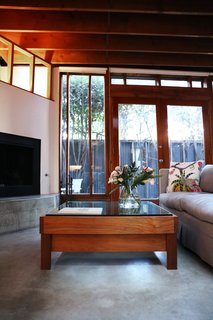Peek Inside the Frank Gehry Rental of an Emerging L.A. Furniture Designer - Photo 9 of 11 - Kristin, who often creates custom projects for private clients, designed the Horizon coffee table as a birthday gift for William. Its glass and teak are meant to recall the materials in the house.