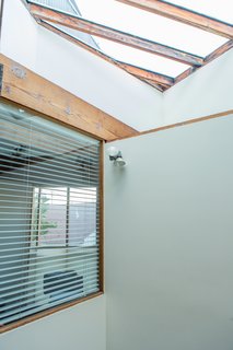 Peek Inside the Frank Gehry Rental of an Emerging L.A. Furniture Designer - Photo 5 of 11 - "The light from the light well is so beautiful during the day," resident William Fowler says. "And even though the house is a block from the boardwalk (ground zero for Venice weirdness), it's peaceful." Shielded from from the street by its corrugated-metal siding, the house opens up vertically thanks to the skylight. 