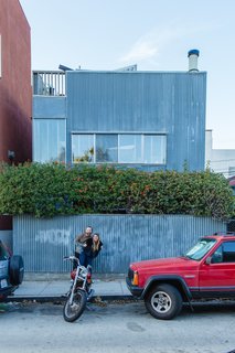 Peek Inside the Frank Gehry Rental of an Emerging L.A. Furniture Designer - Photo 1 of 11 - William Fowler and Kristin Grant Fowler of Dust to Dust Furniture outside their home in Frank Gehry's 1980 corrugated-iron Spiller House in Venice Beach, California. 