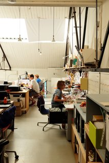 Meet the London Furniture Designers Working in a Reclaimed Railway Shed - Photo 5 of 11 - The design team works in the mezzanine, which is reached by a spiral staircase. Here they make models, finish in-house products, and work on prototypes.