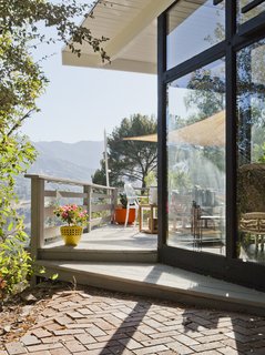 Graphic Design Inspired This Handcrafted Canyon Hideaway - Photo 2 of 10 - "Every single room in the house connects to the outside," Lara says. "Being New Yorkers who moved to California, feeling like we were living in the mountain was huge for us. Our deck really is an extension of the living room." 