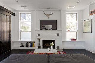 Graphic Design Inspired This Handcrafted Canyon Hideaway - Photo 7 of 10 - The famous Rose Bowl Flea Market in Pasadena was a source for many of the house's vintage elements—including sliding barn doors and the axes used as door pulls on the home's exterior.