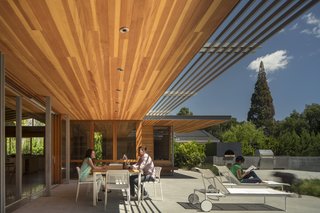 Channeling Midcentury Modern in Northern California - Photo 4 of 7 - A wall of sliding glass doors collapses the divide between inside and outside. 