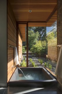 Channeling Midcentury Modern in Northern California - Photo 5 of 7 - An onsen, or Japanese soaking tub, with a private garden abuts the master suite.