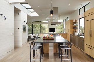 The home includes an eat-in kitchen as well as a distinct, sunken dining area.