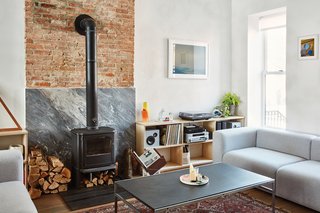 The first floor holds the living room, which includes a Morsø 3440 wood-burning stove and a pair of Mags sofas by HAY. 