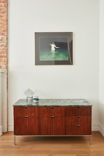 The console is vintage Florence Knoll. 