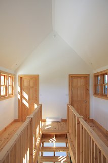 Several types of wood were used to build the house, including red pine for the floors, white cedar for the porch, and black spruce for the siding. 