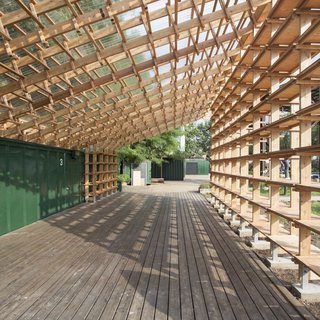 Architecture Remix - Photo 6 of 8 - The design works around an existing shipping container and deck. By folding the roof along the edge of the container, Hou de Sousa was able to optimize materials and achieve the desired structural load distribution. 