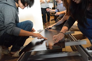 When Building a House Is the Ultimate Final Exam - Photo 4 of 8 - Students build a mock up of the Eco-Screen, a system that uses solar energy and provides better air quality. 