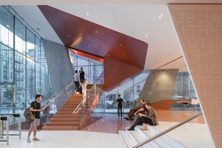 Design Diagnosis: Back to School - Photo 2 of 3 - The lobby features seating and a cafe with views overlooking the courts. 