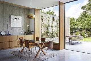 The dining room table is from Habitat. The oak veneered plywood is by Peter Benson Plywood. 