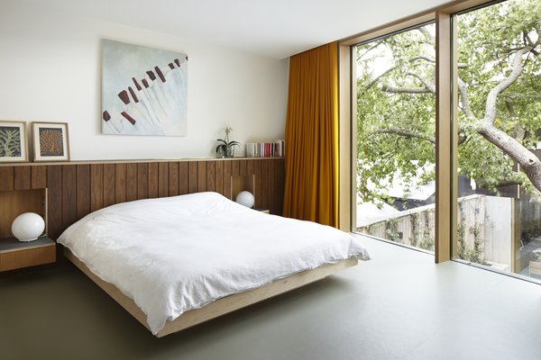 This Modern Courtyard Home Celebrates a 100-Year-Old Tree - Photo 8 of 8 - Edgley Design designed the beds and headboards in the bedrooms. Just one of the several bespoke details that the firm included in the home. 