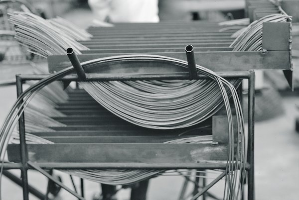 Making Bertoia - Photo 2 of 14 - The stainless steel metal rods used in the assembly of the Bertoia Collection. Image from the Knoll Archive.