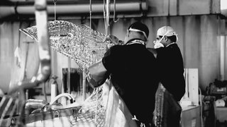 Workers cleaning a Bertoia Bird Chair by hand. Photograph by Knoll.