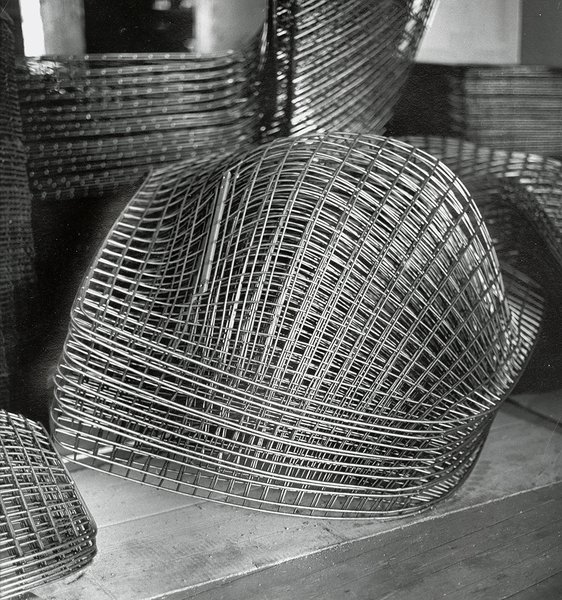Making Bertoia - Photo 12 of 14 - Finished Bertoia Diamond Chair frames stacked and awaiting assembly. Image from the Knoll Archive.
