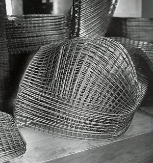 Finished Bertoia Diamond Chair frames stacked and awaiting assembly. Image from the Knoll Archive.