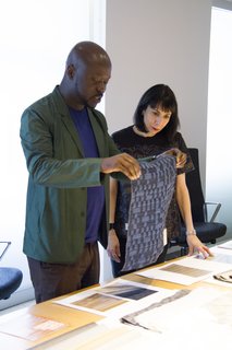 David Adjaye with Dorothy Cosonas reviewing Dakar drapery from The Adjaye Collection for KnollTextiles. Photography by KnollTextiles.