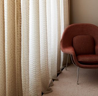 Kampala-upholstered Womb Chair with Dakar drapery. Photography by KnollTextiles.