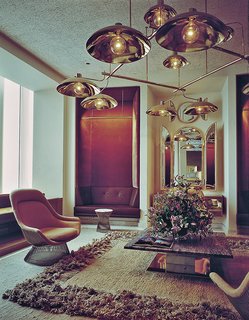 Knoll Inspiration: Introducing Platner Gold - Photo 3 of 6 - The Windows on the World reception room, designed by Warren Platner in 1976, included a Platner Easy Chair and Platner Side Table. Photograph courtesy of the Nestlé Library.
