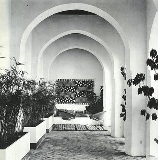 Morocco Modern - Photo 11 of 11 - Looking down one of the arcades around the central courtyard, lined with papyrus plants and Berber rugs. 