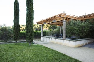 A Northern California Winery’s Breathtaking Vistas Are Enhanced by Natural Redwood - Photo 1 of 5 - The larger pergola is outside of the winery’s main tasting room, and provides a cool outdoor space for patrons.