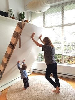 Making Room for Baby
(And You) - Photo 2 of 4 - Theo helps his mom put the Penelope up in the morning!