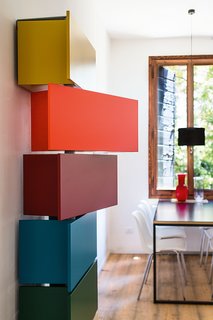 Making Room for Baby
(And You) - Photo 3 of 4 - The playful Giralot features storage modules that rotate open.
