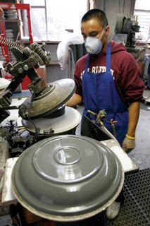 Sausalito Dinnerware Factory Tour - Photo 6 of 35 - This plate is formed on an automated jigger machine. It will remain on the mold until it dries.