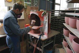 Sausalito Dinnerware Factory Tour - Photo 24 of 35 - Glaze is applied to the pieces by hand with a spray gun.