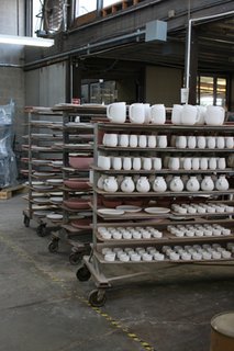 Sausalito Dinnerware Factory Tour - Photo 26 of 35 - Formed, trimmed and glazed pieces wait to be fired on a ware cart.