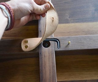 Jacob May Design - Photo 7 of 7 - The single tool required for assembly is contained beneath a leather flap under the table. 