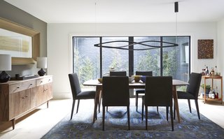 Ventura dining table, Ava chairs, Grove cabinet, Simone lamp, Heriz rug