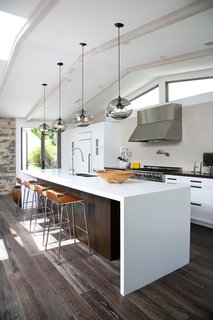 10 Open Kitchen Solutions That Will Get Things Cooking - Photo 5 of 10 - Niche's Terra pendants in gray glass draw attention to this kitchen island over which they hang—adding a timeless touch to a modern interior.