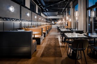 Guests Enjoy Meal Under Modern Restaurant Pendant Lighting in Sweden - Photo 3 of 3 -