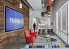 Three Binary pendants in Gray glass hang in one of several breakout spaces for HubSpotters to collaborate with each other in smaller groups. Hanging among Graypants lighting, which are handmade entirely of repurposed cardboard, Niche's Binary pendants help to create a comfortable and inspiring work environment. Photo 3 of HubSpot Offices modern home