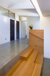 A playroom and family room opens out to the courtyard, and ties to the bedroom hall through a "stage" for the kids.