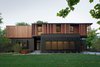 Sustainable elements of the home include a geothermal heat pump HVAC system, energy efficient windows and sprayed foam insulation. The exterior wood is a vertical shiplap siding milled from FSC certified Machiche. BauLinder Haus was designed to meet and exceed requirements put forward by the U.S. Environmental Protection Agency for their Indoor airPLUS qualified homes, and is working toward Energy Star qualification.
#sustainable #courtyard #wood #kansascity #baulinderhaus #hufft
Photo credit by Mike Sinclair Photo 3 of BauLinder Haus modern home
