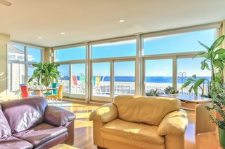 Captivating Oceanfront Home: Sit back and enjoy the captivating panoramic oceanfront views from this custom-built contemporary estate in Belmar, New Jersey. An open design concept showcases the grand views with floor to ceiling areas on the second and third levels. Presented by Ward Wight Sotheby’s International Realty.